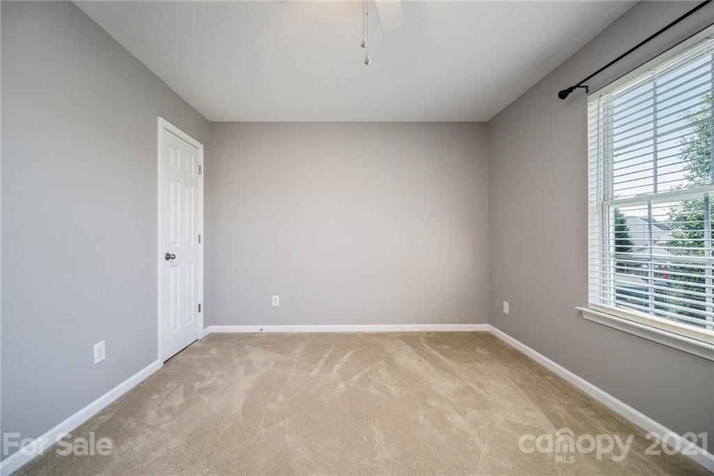 141 Rhyne Springs Road Mount Holly, NC 28120 - Photo 16 of 17 a view of an empty room with a window