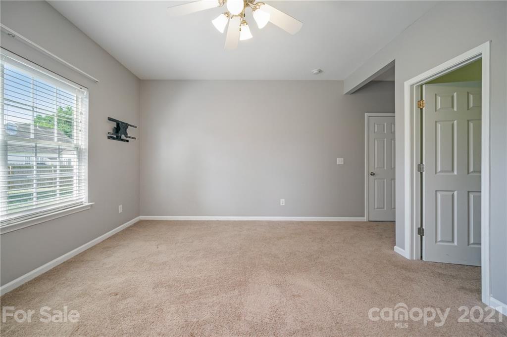 141 Rhyne Springs Road Mount Holly, NC 28120 - Photo 4 of 17 an empty room with a window