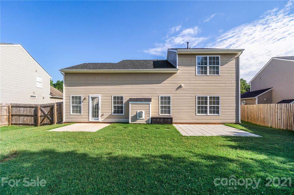 141 Rhyne Springs Road Mount Holly, NC 28120 - Photo 5 of 17 a view of a house with a yard and sitting area