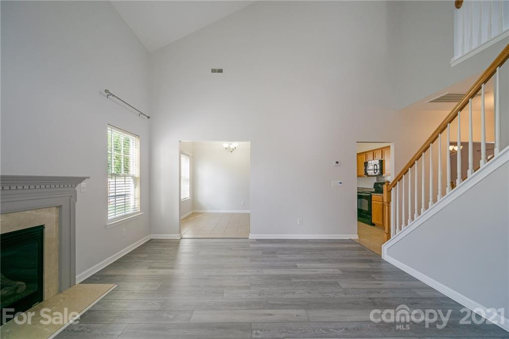 141 Rhyne Springs Road Mount Holly, NC 28120 - Photo 10 of 17 a view of an empty room with window and fireplace