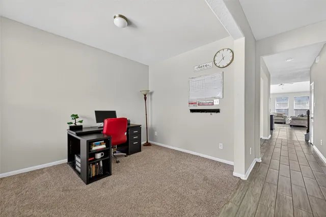 a view of a workspace with furniture