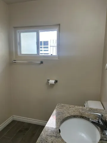 a bathroom with a sink and toilet