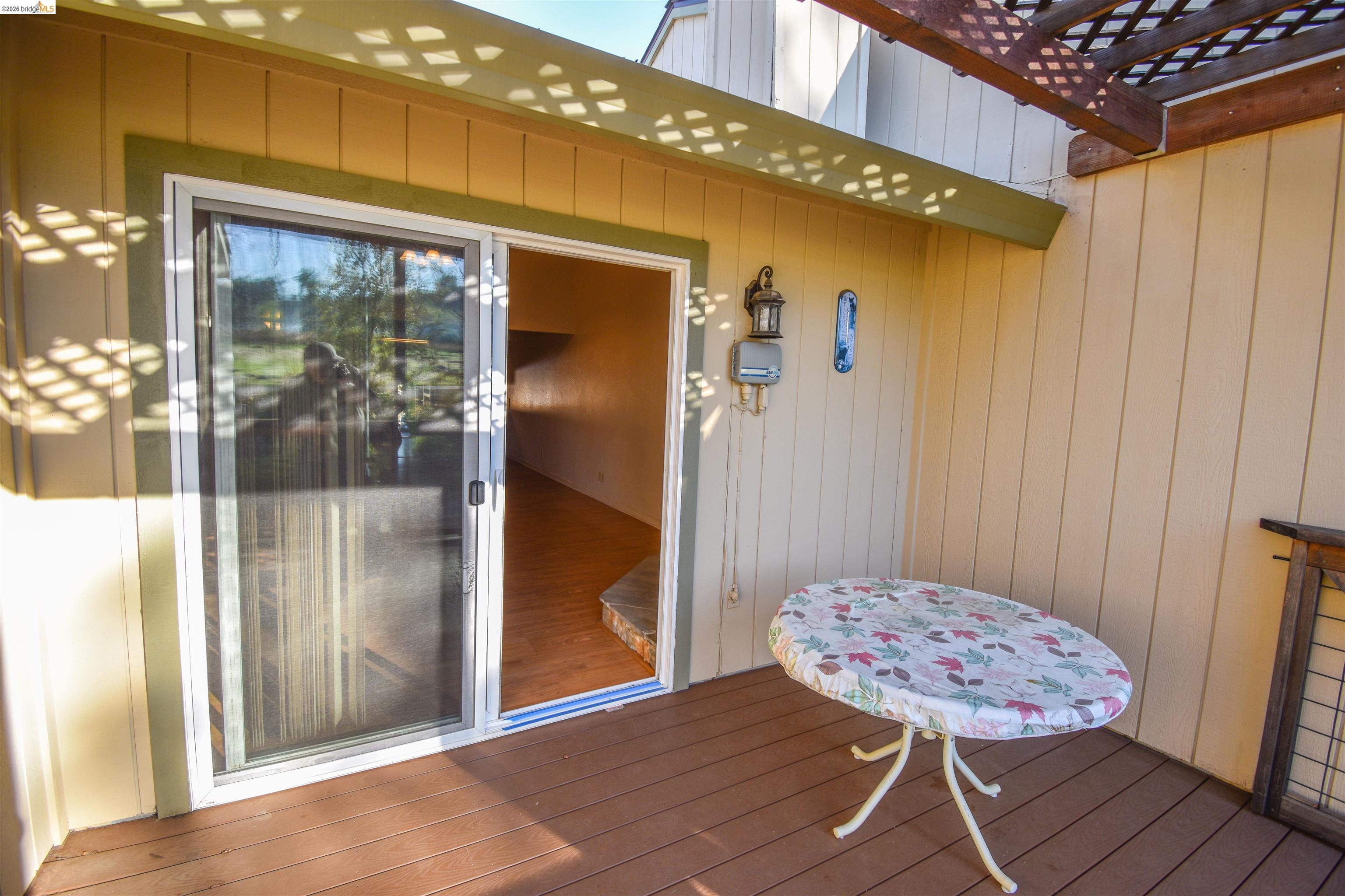 23685 Marble Quarry Road, Unit 22 Columbia, CA 95310 - Photo 23 of 33 View of exterior entry featuring a deck and a pergola