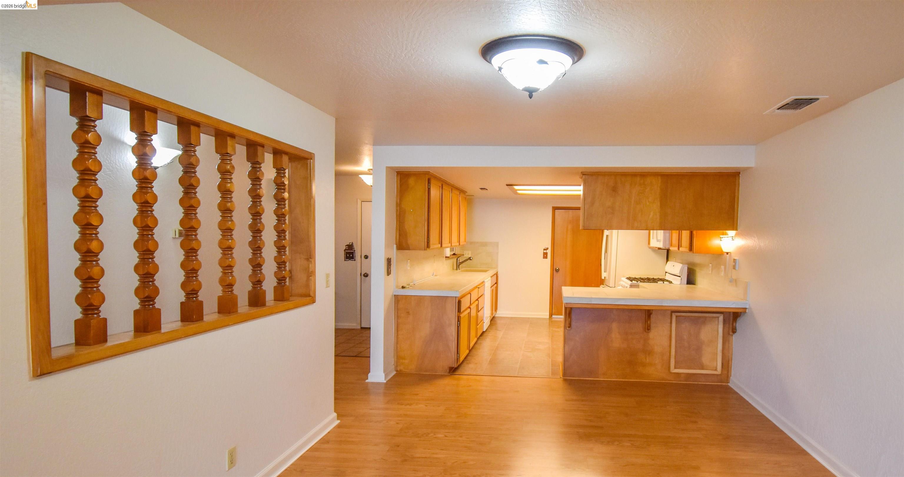 23685 Marble Quarry Road, Unit 22 Columbia, CA 95310 - Photo 8 of 33 Hallway featuring light wood finished floors and baseboards