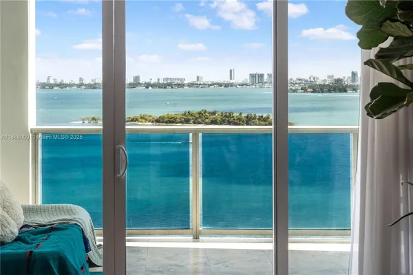 a view of a glass door and porch