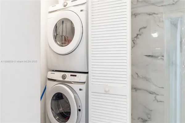 a view of a hallway with washer and dryer