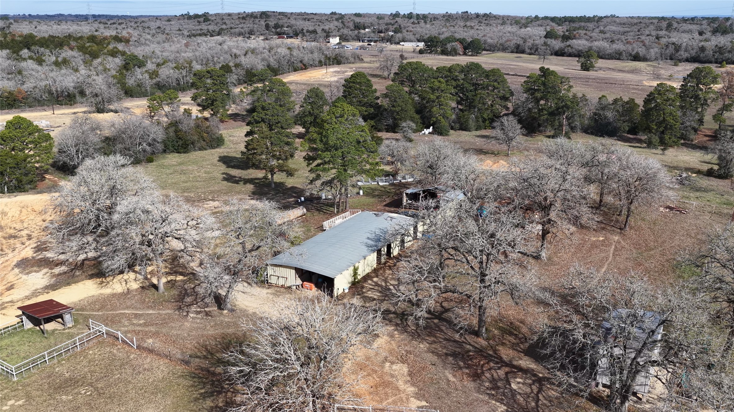 182 Little Ranch Road Red Rock, TX 78662 - Photo 12 of 40 Aerial overview of property's location with rural landscape