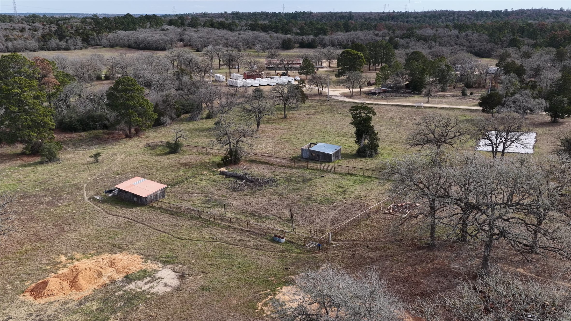 182 Little Ranch Road Red Rock, TX 78662 - Photo 14 of 40 Aerial view of property and surrounding area with rural landscape