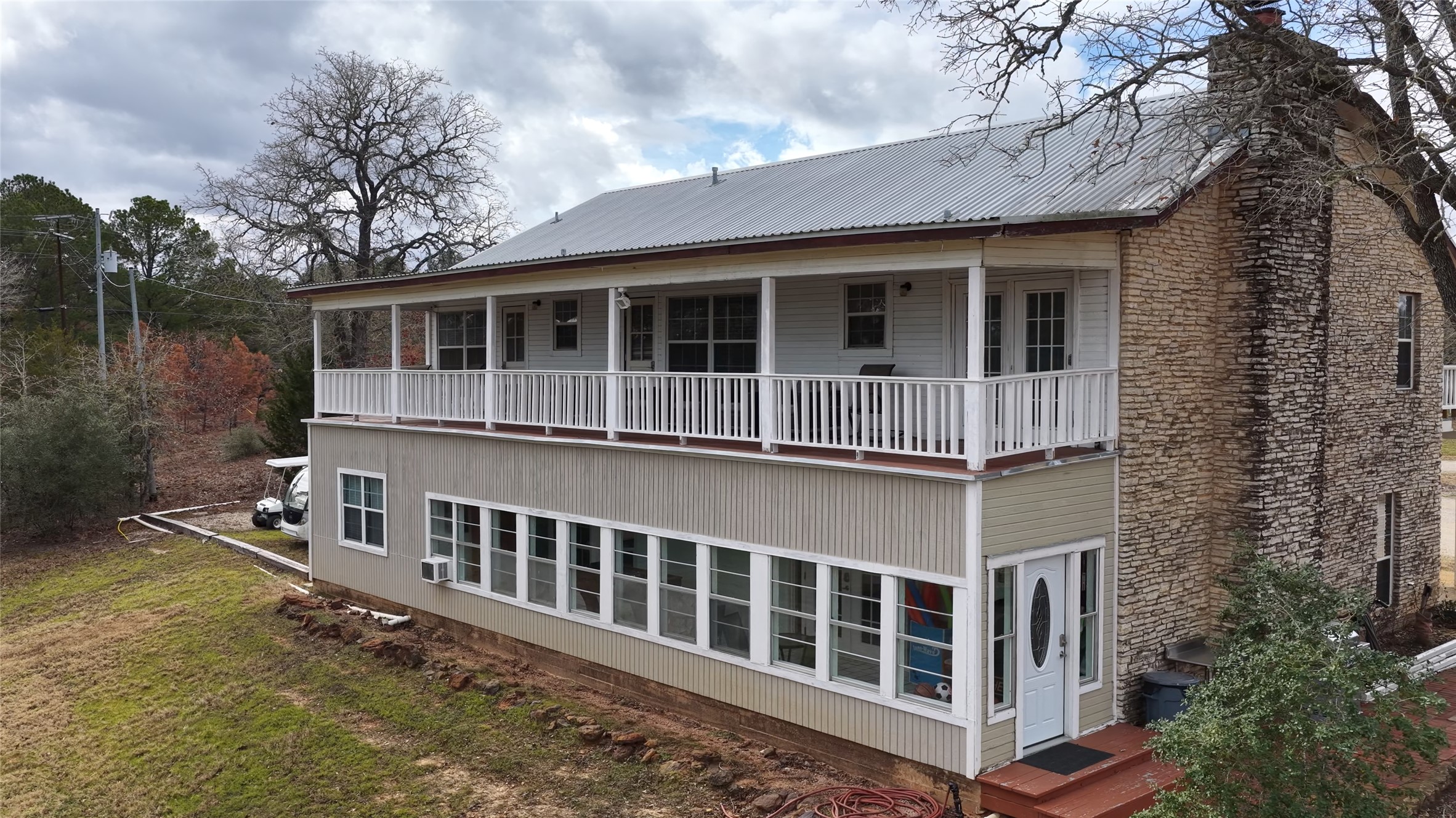 182 Little Ranch Road Red Rock, TX 78662 - Photo 16 of 40 Rear view of property with a chimney and a metal roof