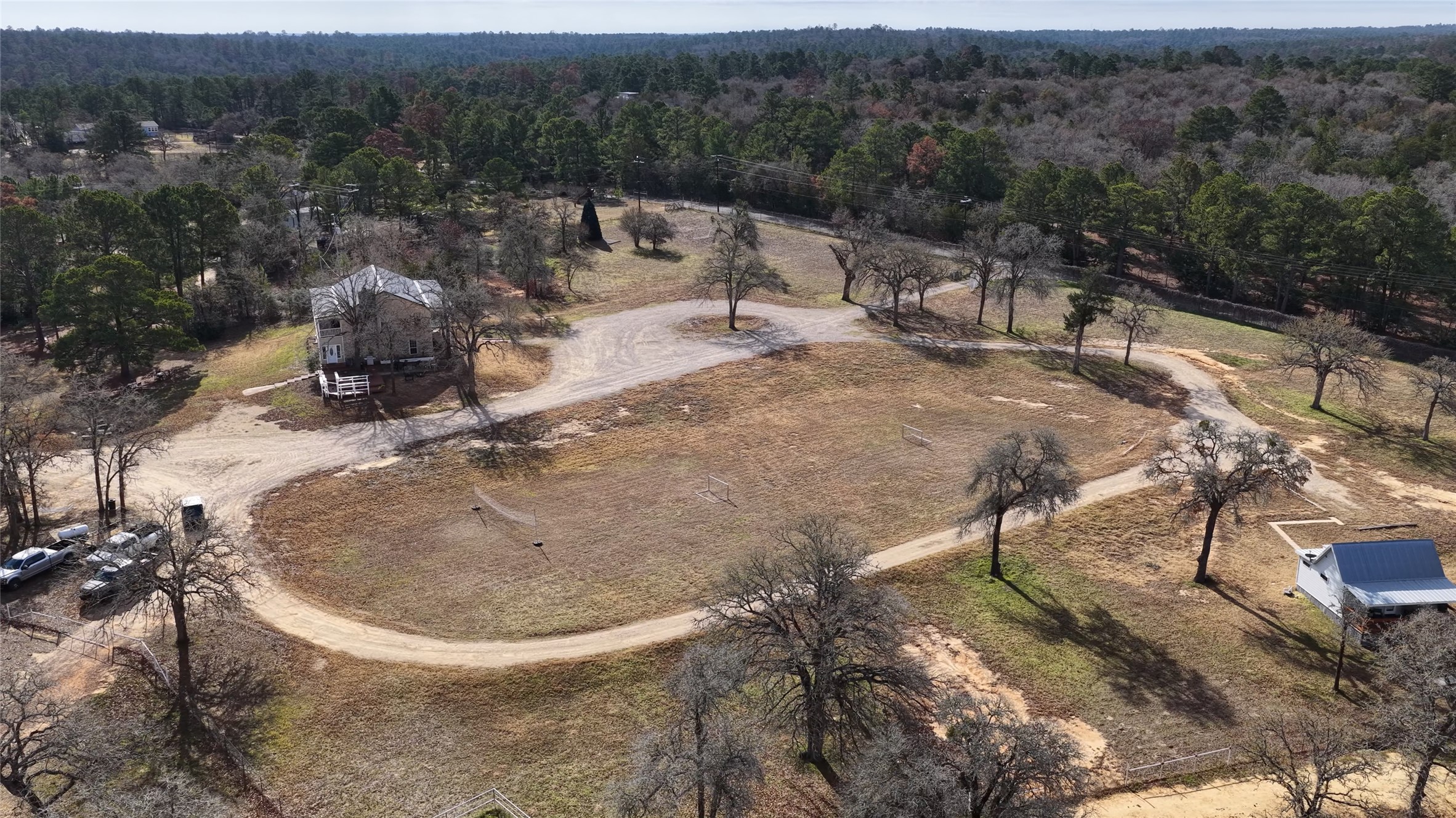 182 Little Ranch Road Red Rock, TX 78662 - Photo 2 of 40 Bird's eye view of a heavily wooded area