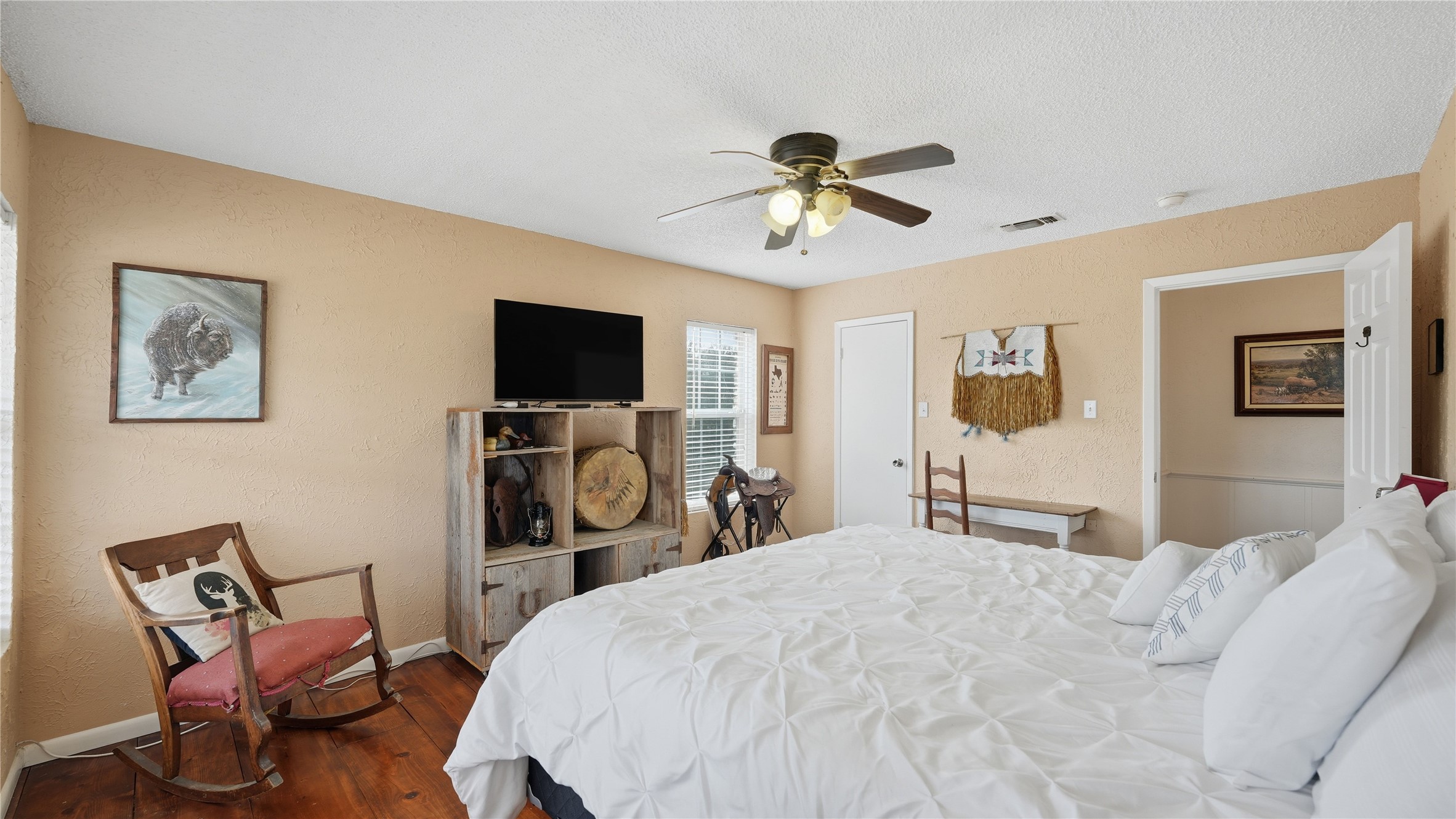 182 Little Ranch Road Red Rock, TX 78662 - Photo 25 of 40 Bedroom with a ceiling fan and dark wood-style floors