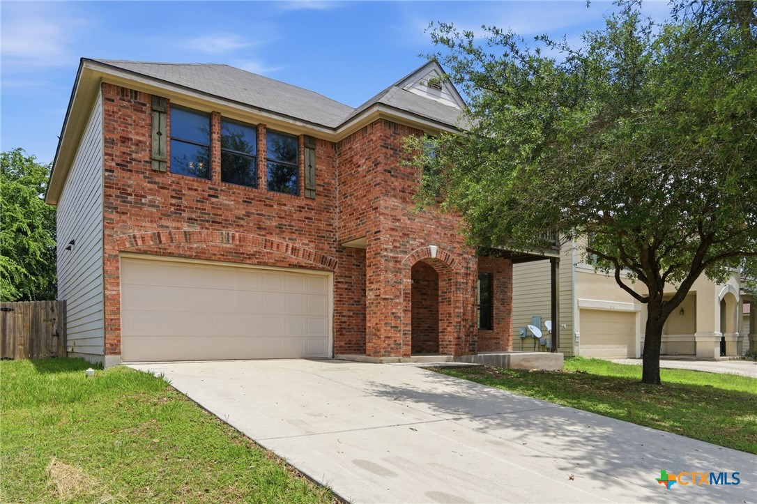 8716 Starview Street Temple, TX 76502 - Photo 2 of 36 Front exterior view of the brick home featuring a mature shade tree.