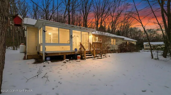 a view of outdoor space with porch and furniture