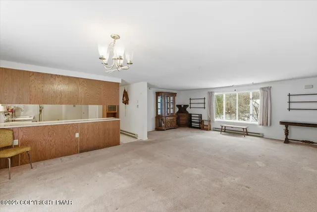 a view of a livingroom with furniture and window