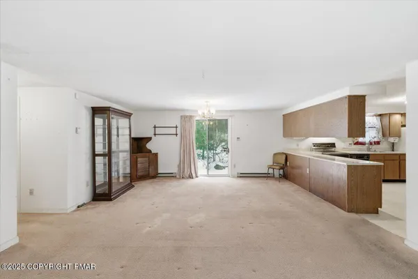 a large bedroom with a bed and a large window