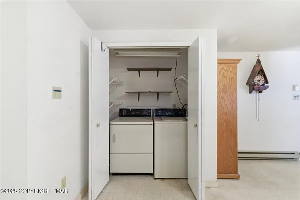 a utility room with washing machine