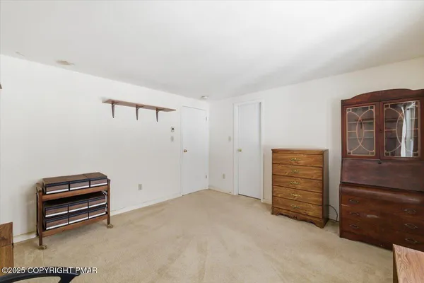 a view of room with furniture and windows