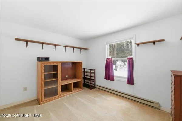 a view of an empty room with a fireplace
