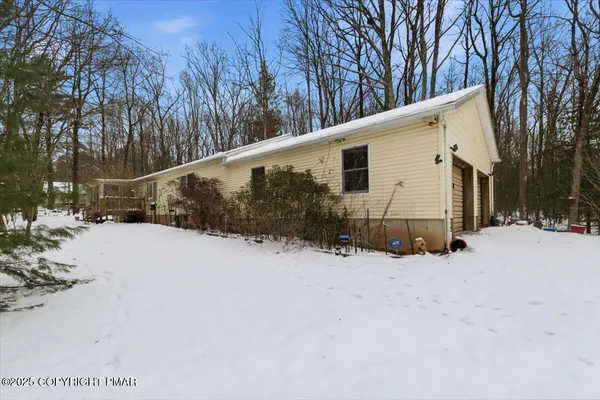 a view of a house covered in snow