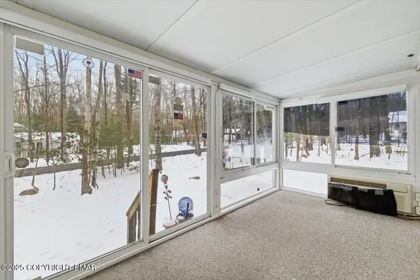 a living room with large windows
