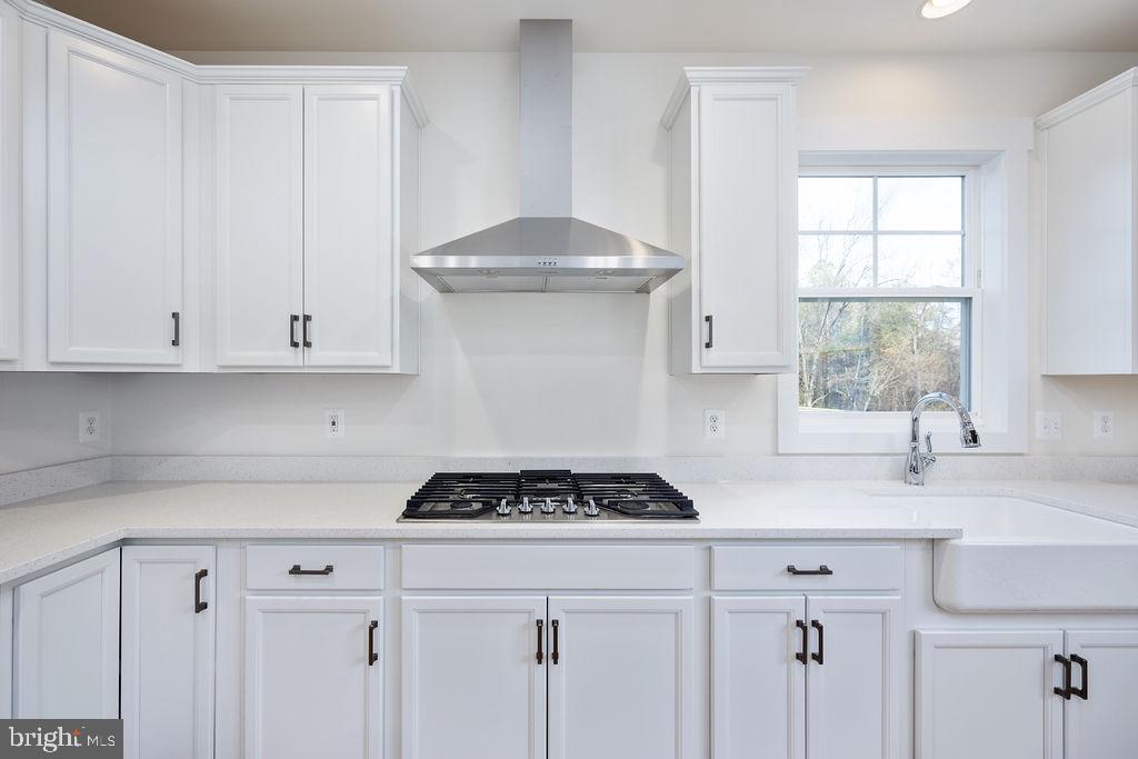 1985 Garrisonville Road Stafford, VA 22556 - Photo 28 of 34 Sleek white kitchen with modern accents.