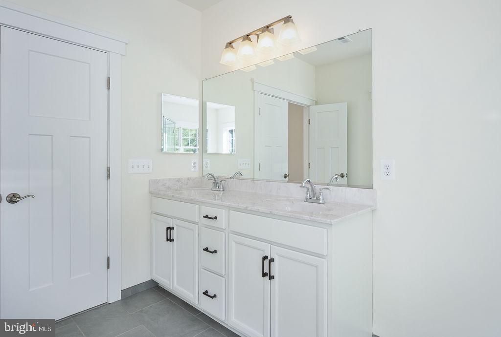 1985 Garrisonville Road Stafford, VA 22556 - Photo 8 of 34 Sleek dual vanity in bright bathroom.