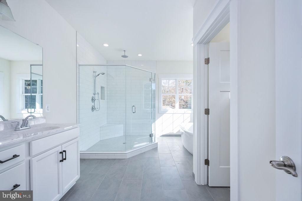 1985 Garrisonville Road Stafford, VA 22556 - Photo 9 of 34 Sleek modern bathroom with natural light.