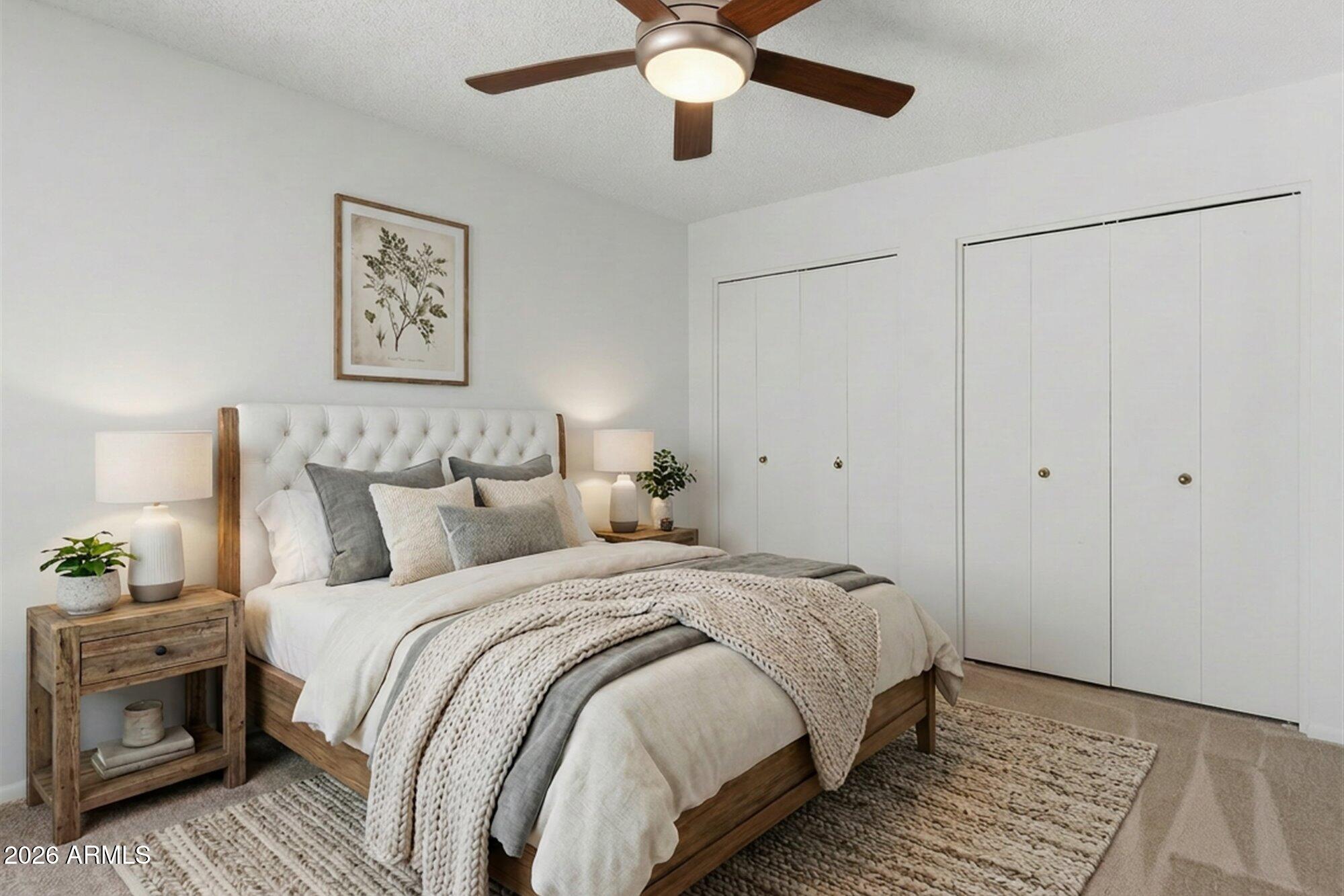 4208 East Carson Road Phoenix, AZ 85042 - Photo 14 of 25 a bedroom with bed and a chandelier