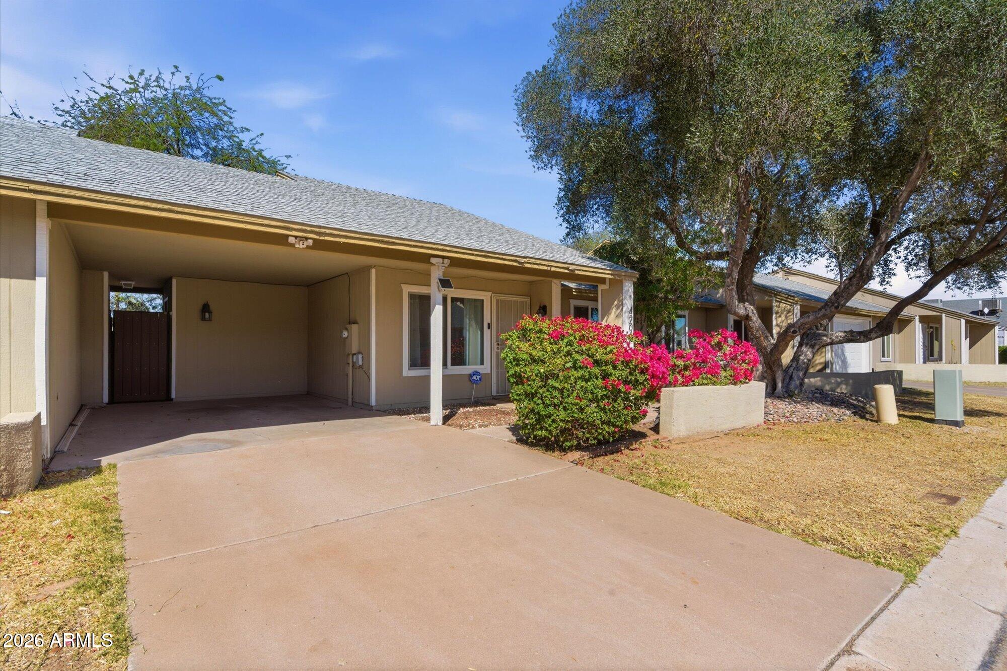 4208 East Carson Road Phoenix, AZ 85042 - Photo 2 of 25 a front view of house with yard