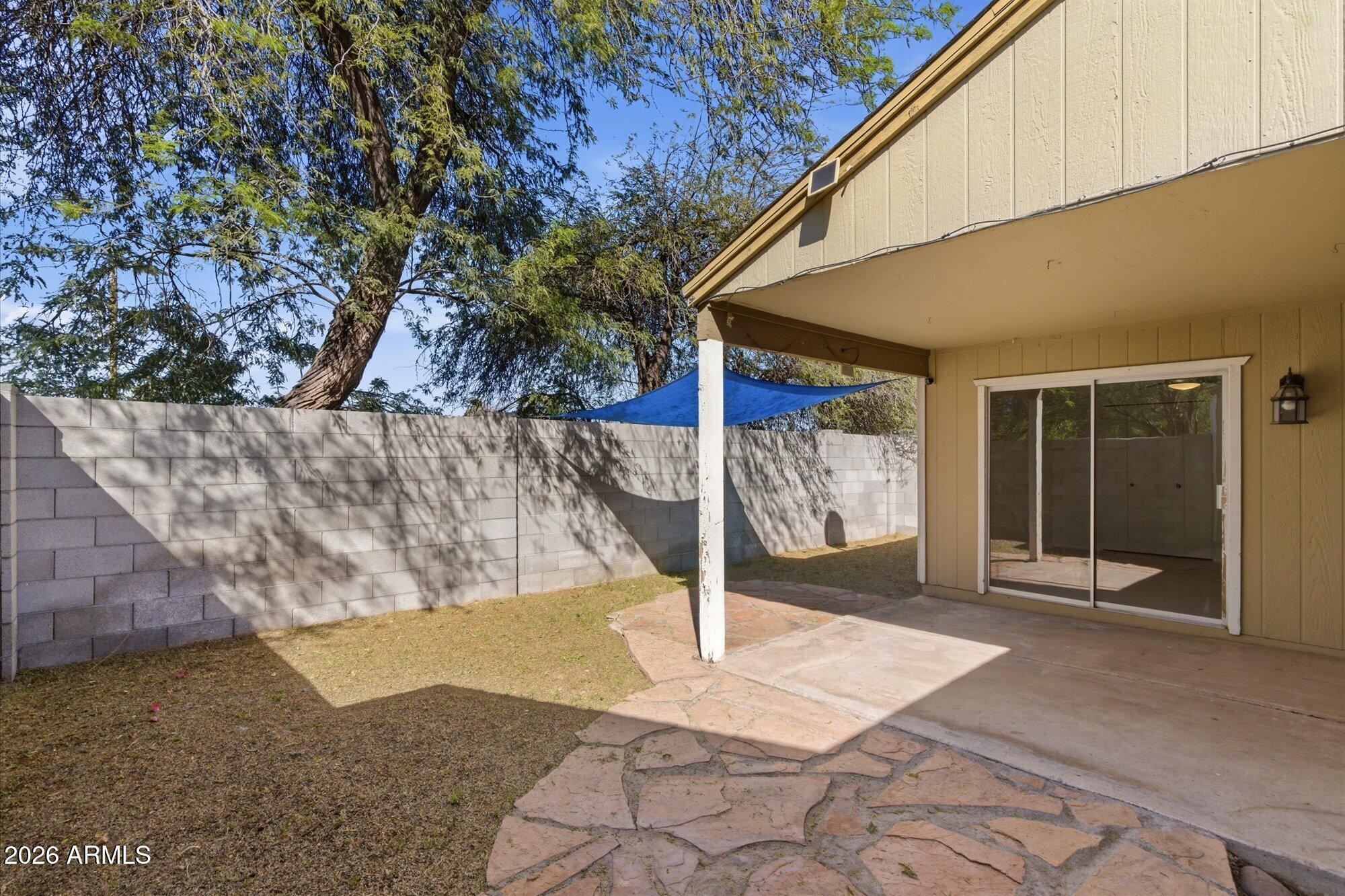 4208 East Carson Road Phoenix, AZ 85042 - Photo 21 of 25 a front view of a house with a yard
