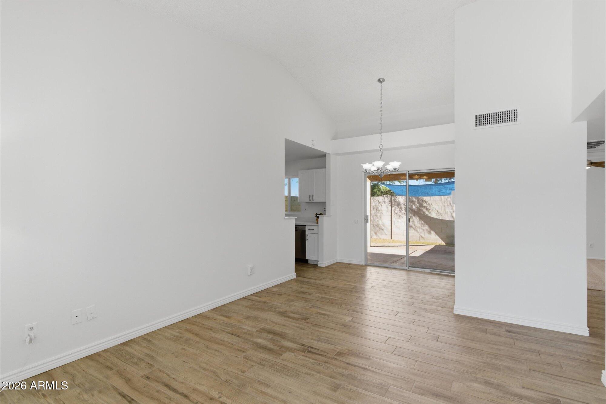 4208 East Carson Road Phoenix, AZ 85042 - Photo 6 of 25 a view of a kitchen cabinets and wooden floor