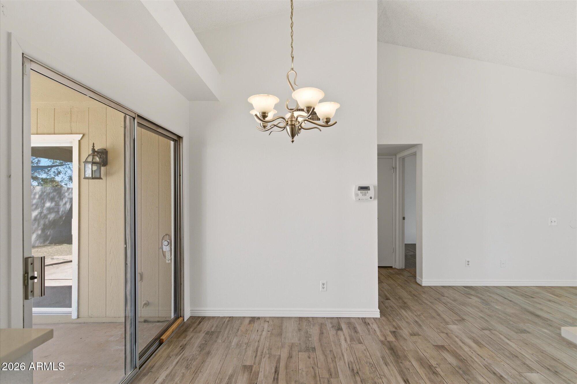 4208 East Carson Road Phoenix, AZ 85042 - Photo 7 of 25 a view of a room with wooden floor