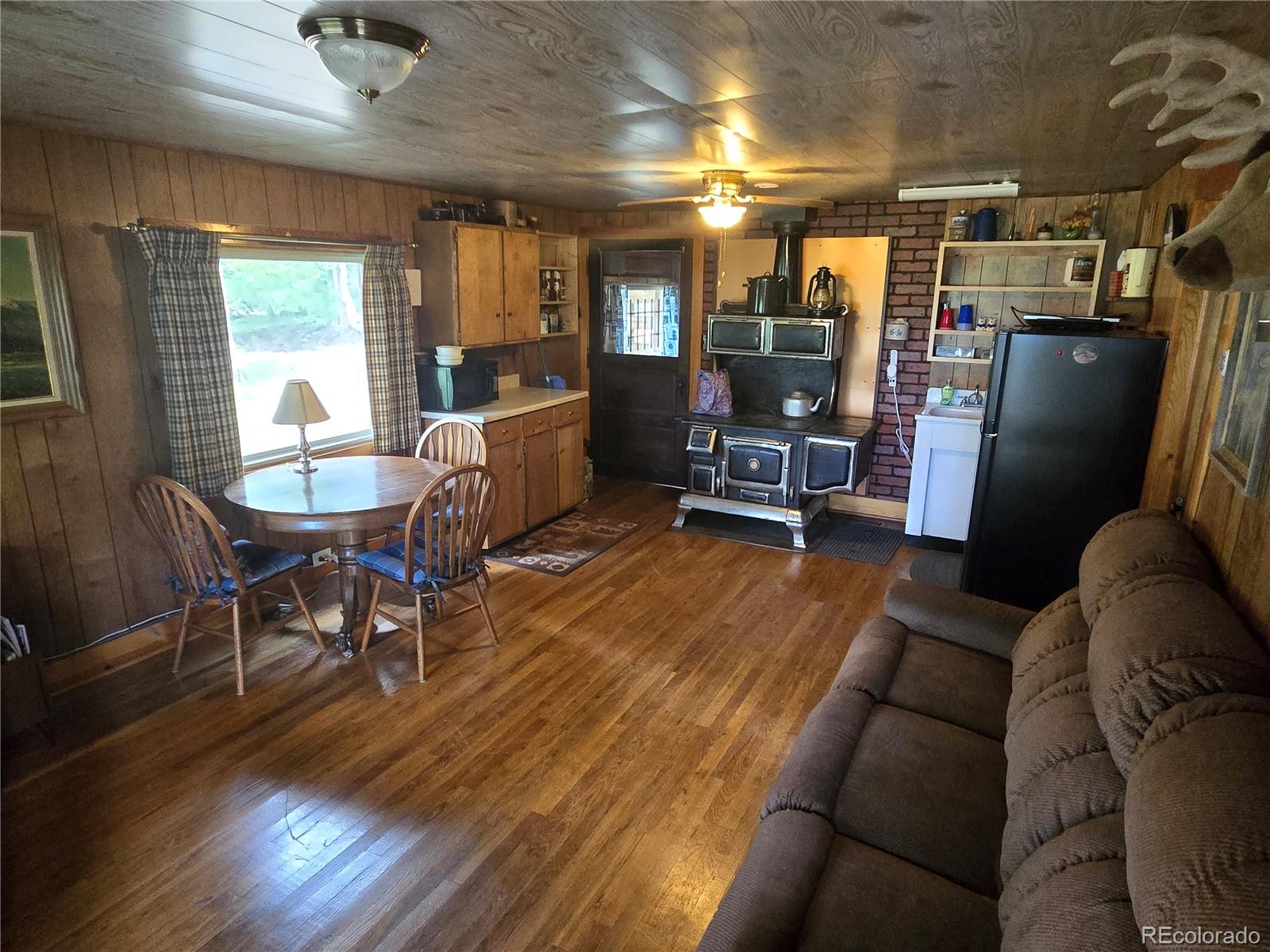9626 Highway 165 Rye, CO 81069 - Photo 11 of 27 a living room with furniture and a wooden floor