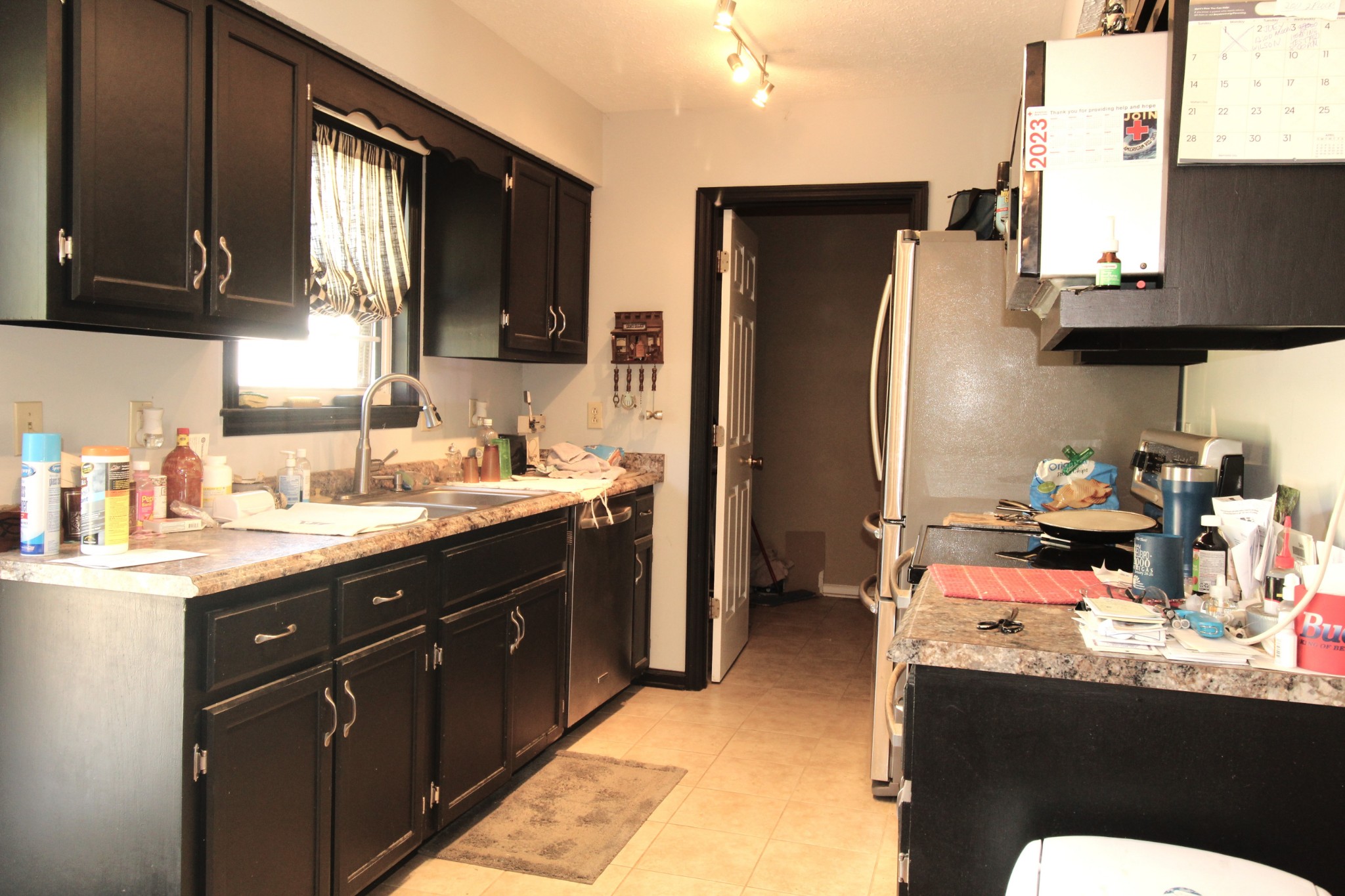 3721 Armstrong Road Springfield, TN 37172 - Photo 6 of 9 a kitchen with stainless steel appliances kitchen island granite countertop a sink stove and refrigerator