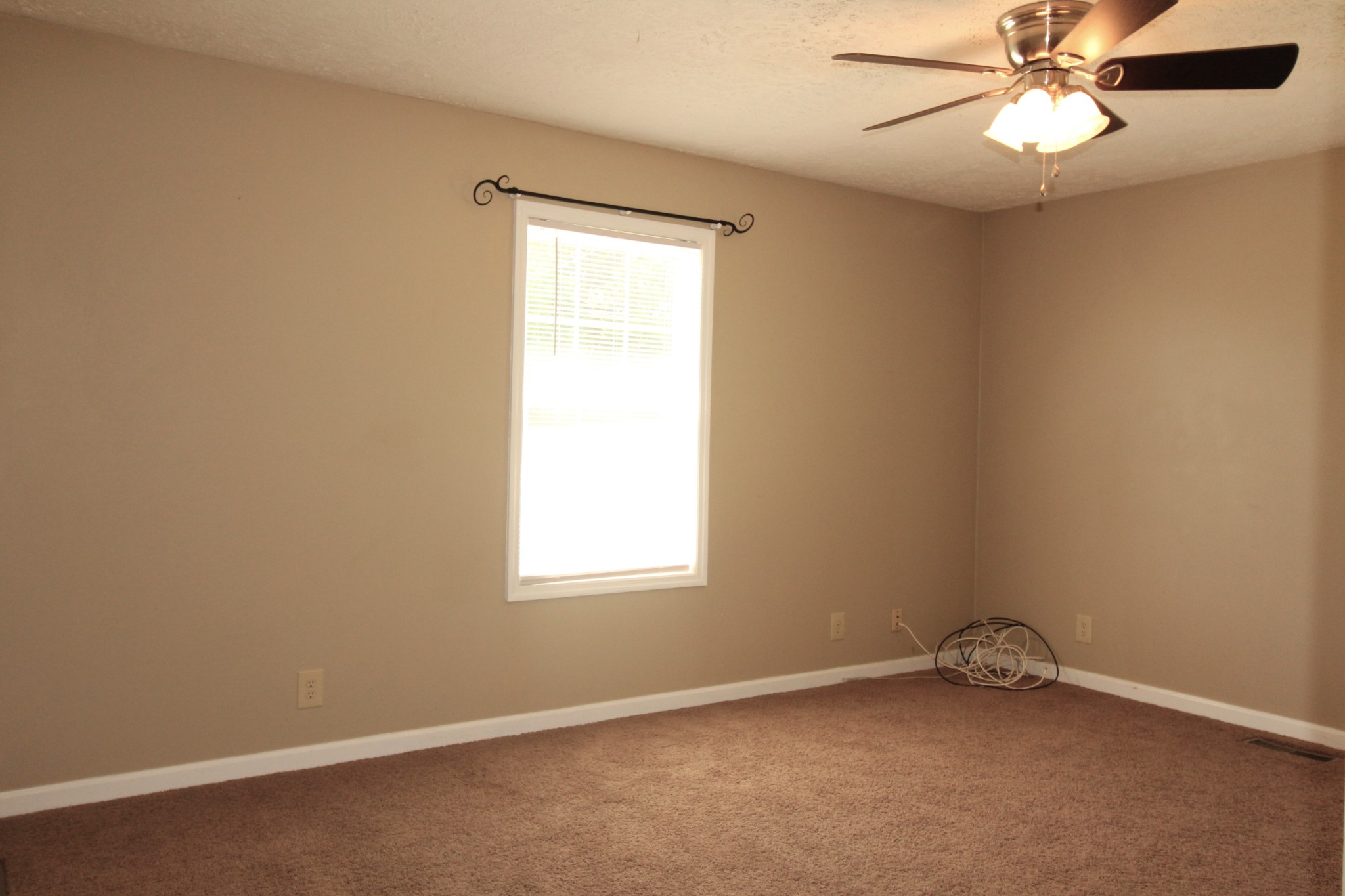 3721 Armstrong Road Springfield, TN 37172 - Photo 8 of 9 an empty room with a window and a fan