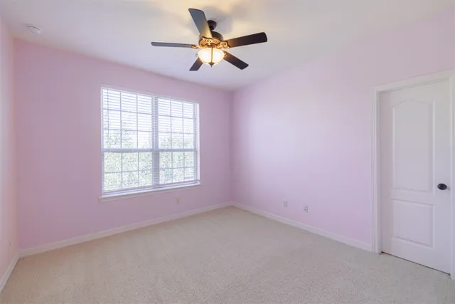 a view of a white house with a outdoor space