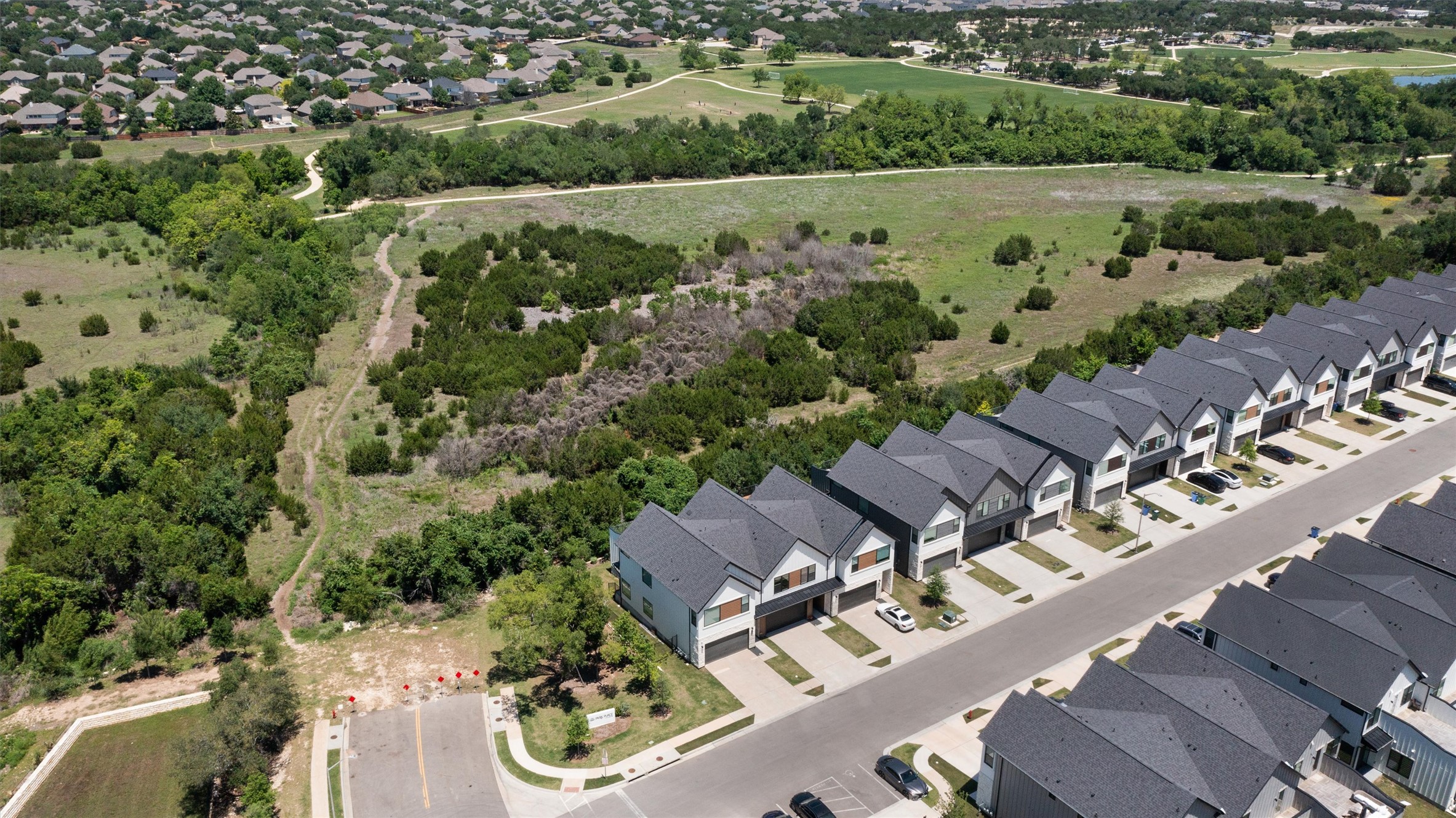 590 Old Mill Road, Unit 153 Cedar Park, TX 78613 - Photo 27 of 40 an aerial view of a house with a yard