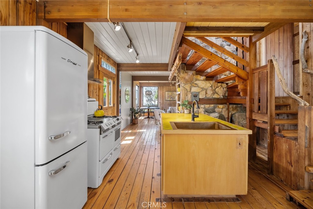 1515 9th Street Los Osos, CA 93402 - Photo 11 of 69 a view of a kitchen with a sink and dishwasher