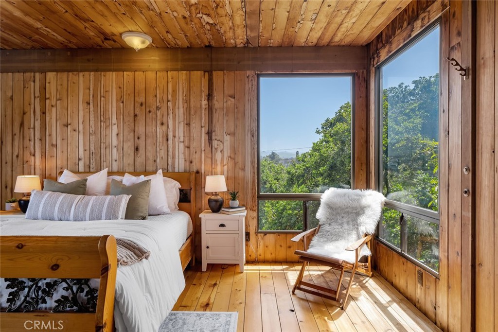 1515 9th Street Los Osos, CA 93402 - Photo 17 of 69 a bed room with a bed and a balcony