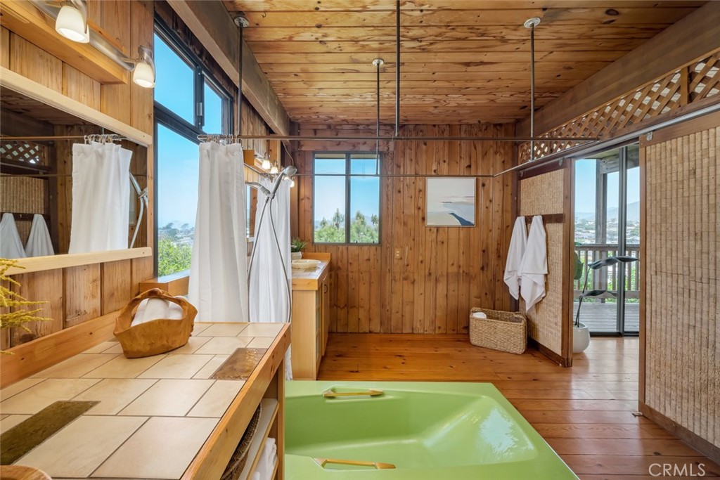1515 9th Street Los Osos, CA 93402 - Photo 25 of 69 a view of a porch with a table and chairs