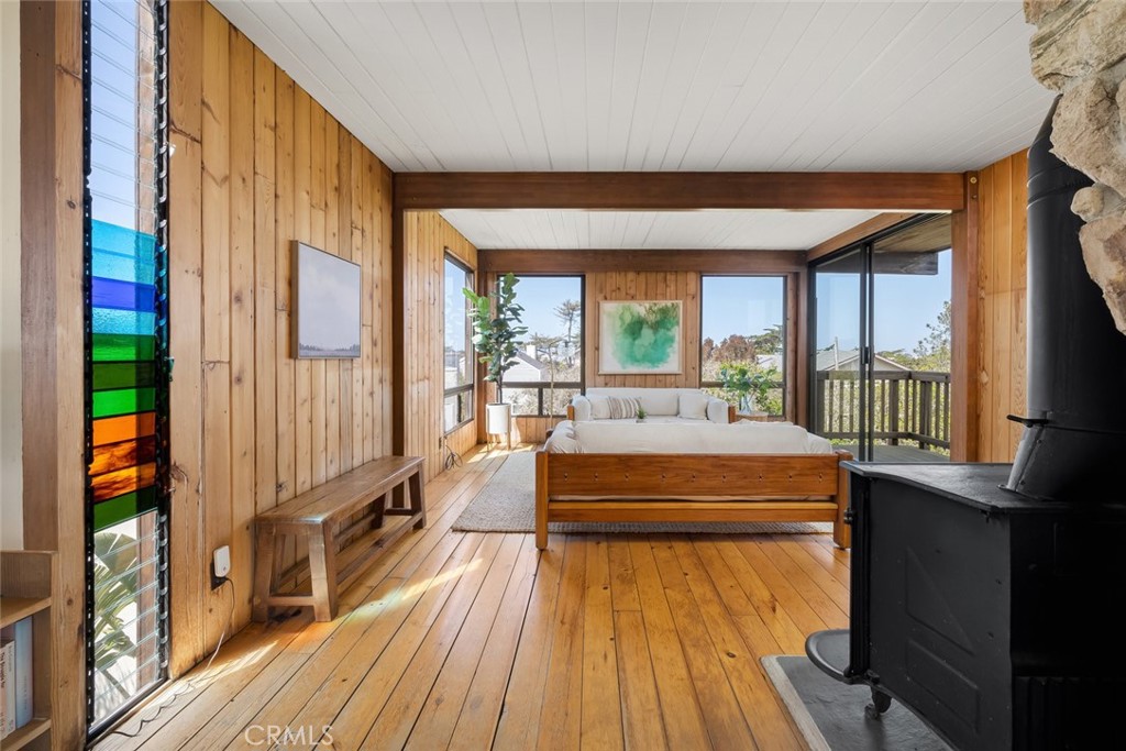 1515 9th Street Los Osos, CA 93402 - Photo 27 of 69 a room with wooden floor table and chairs