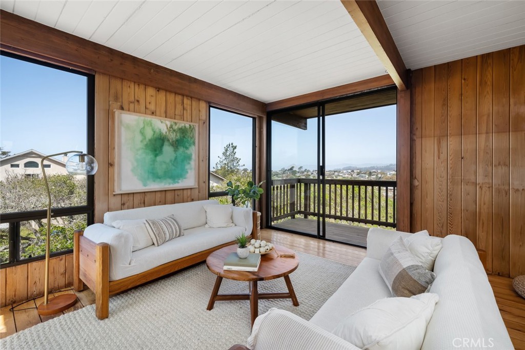 1515 9th Street Los Osos, CA 93402 - Photo 28 of 69 a living room with furniture and a floor to ceiling window