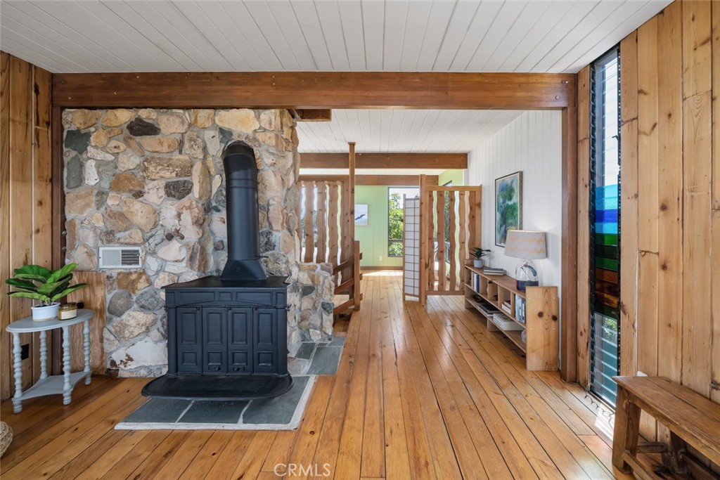 1515 9th Street Los Osos, CA 93402 - Photo 33 of 69 a living room with furniture a wooden floor and a fireplace