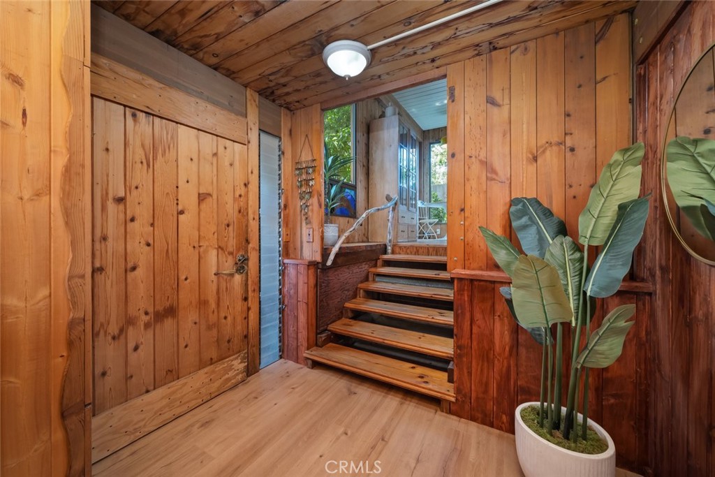1515 9th Street Los Osos, CA 93402 - Photo 4 of 69 a view of entryway with a potted plant and a wooden floor