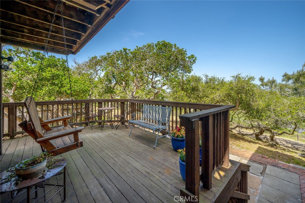 1515 9th Street Los Osos, CA 93402 - Photo 47 of 69 a balcony with wooden floor and outdoor seating