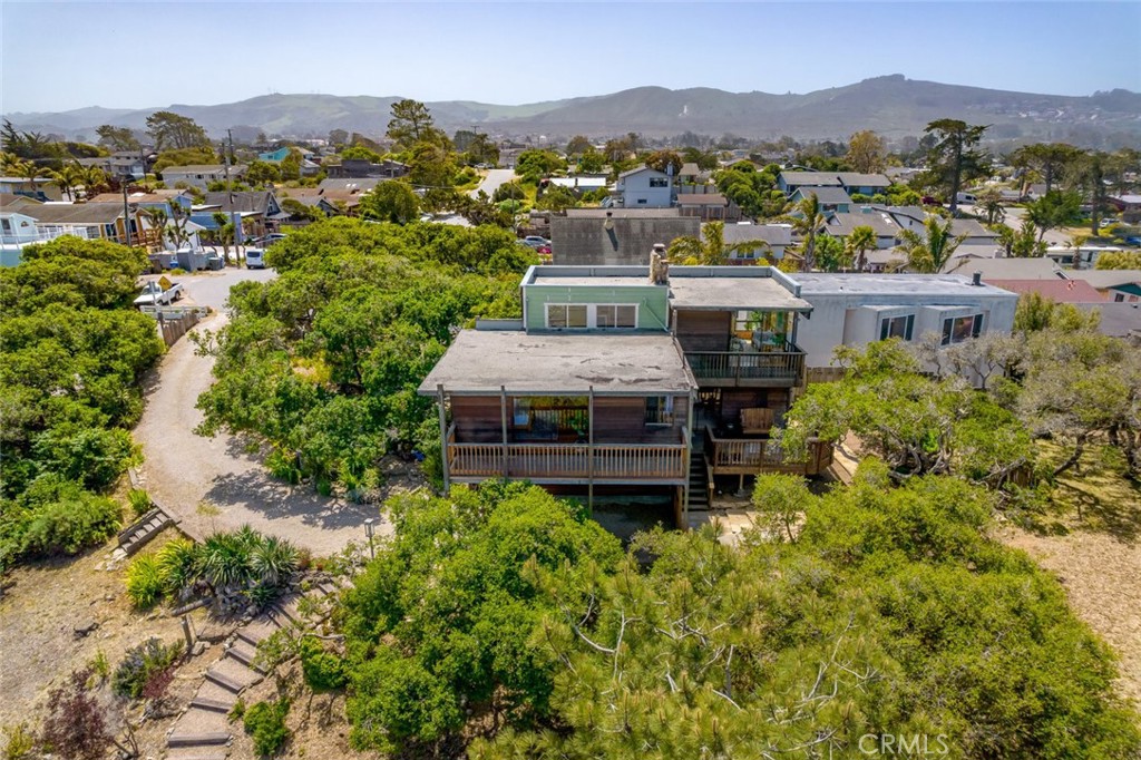1515 9th Street Los Osos, CA 93402 - Photo 65 of 69 an aerial view of a house with a mountain in the background
