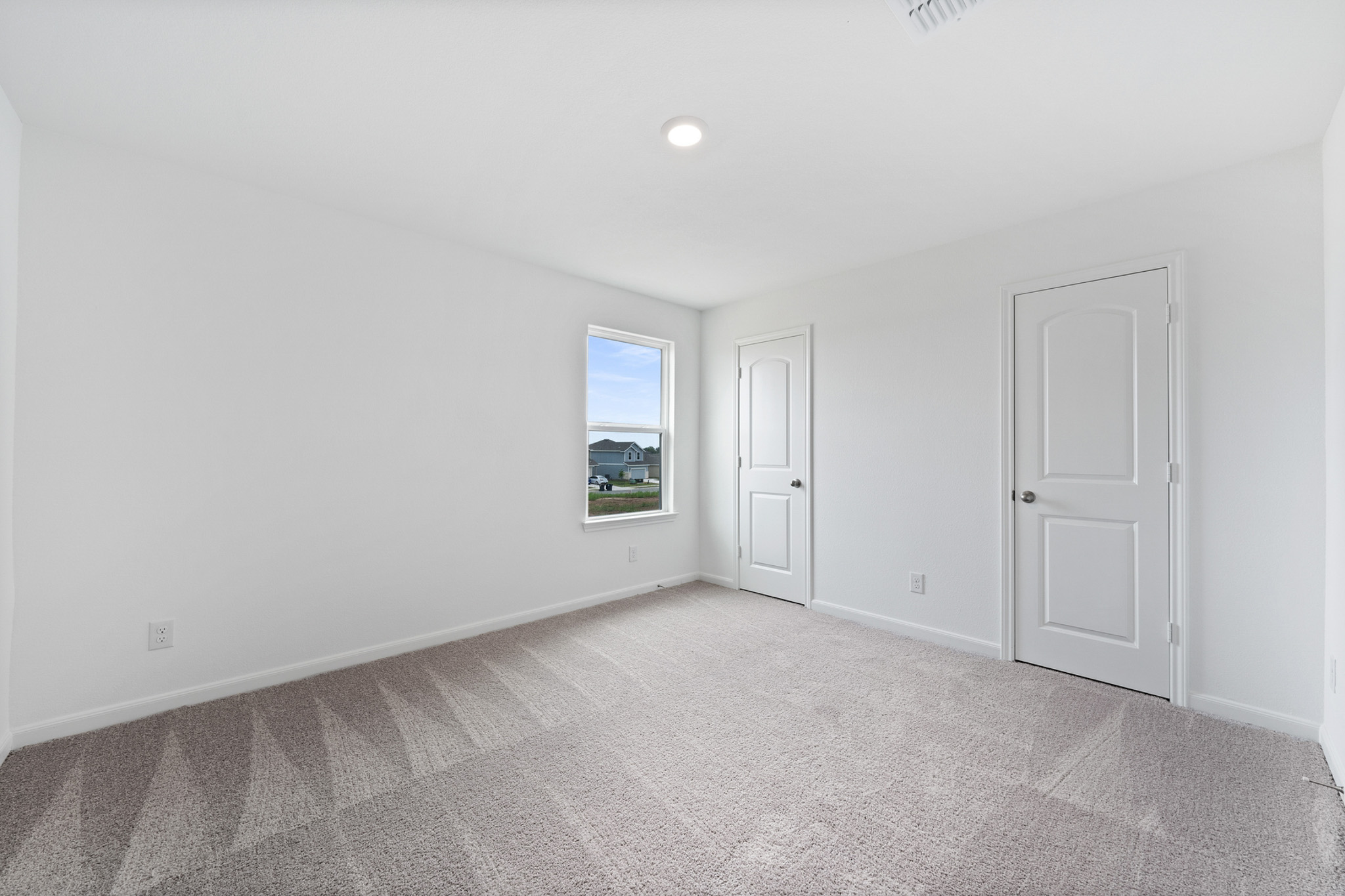 409 Silent Meadow Run Maxwell, TX 78656 - Photo 9 of 10 Unfurnished bedroom with baseboards and light carpet