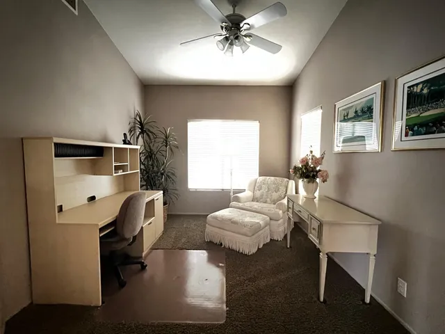 a bedroom with furniture and a window