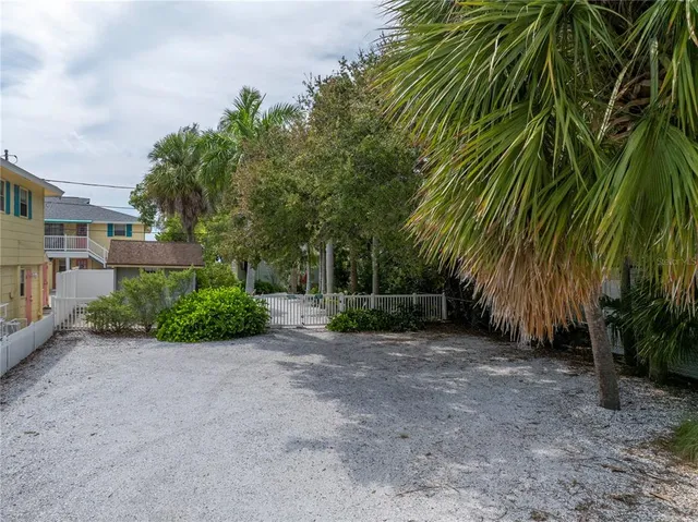 a living room with furniture a chandelier and a fireplace