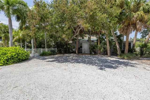 a view of staircase with wooden floor and a chandelier